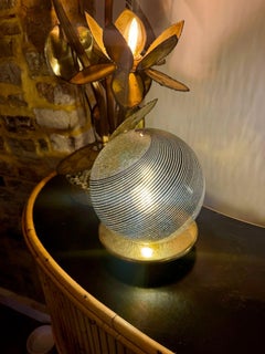 A pair of Italian 1970s smoked Murano glass swirl ball lamps with brass bases