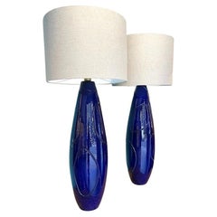 A pair of Italian 1980s large blue ceramic and brass lamps, with new fittings.
