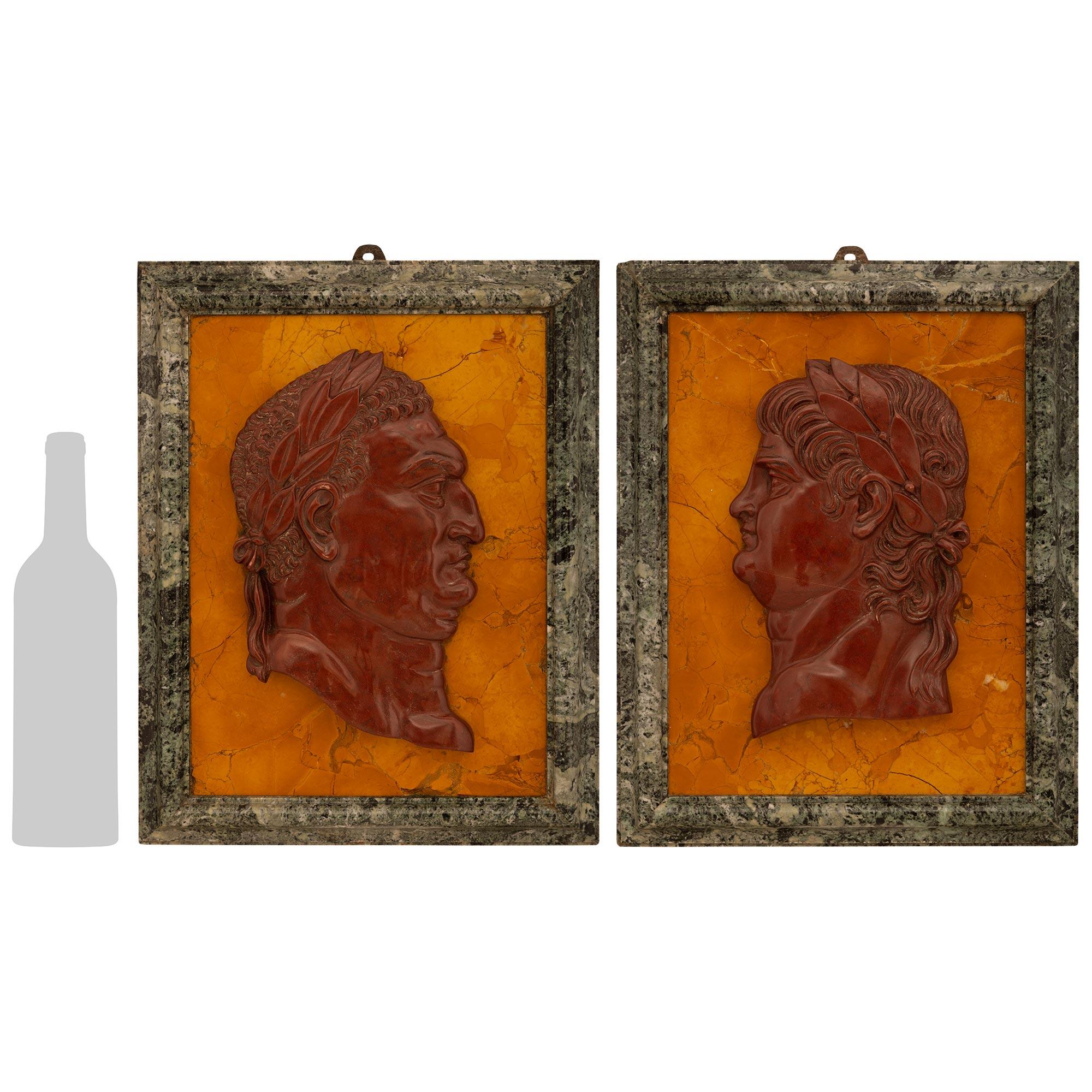 A most decorative and high quality true pair of Italian 19th century Vert de Patricia, Sienna, and Rouge Griotte marble plaques of Roman Emperors. This interesting pair of plaques is depicting Emperor Nero and Emperor Vespasian who ruled in