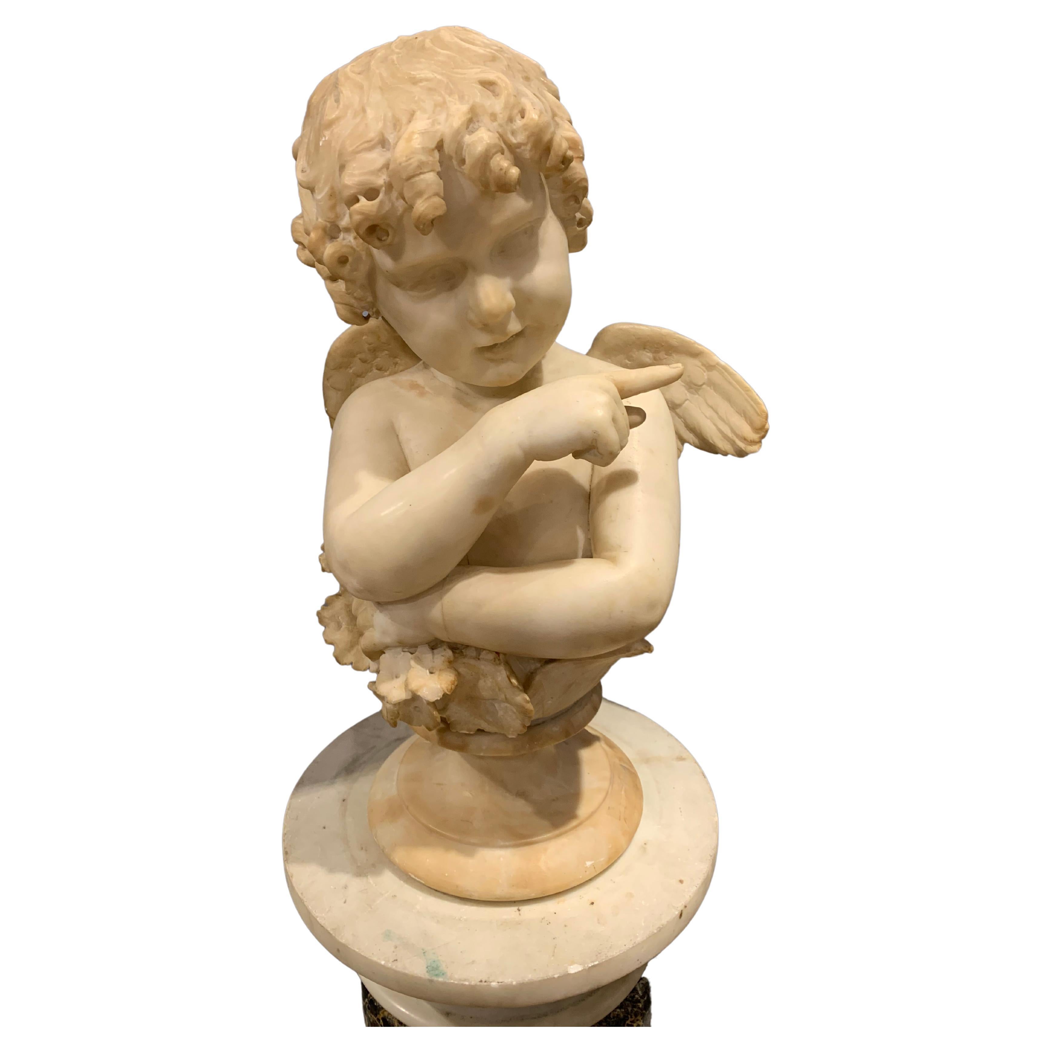 A pair of Italian alabaster busts of Amorini 
By Galleria Lapini, Florence, Late 19th Century 
One inscribed to the reverse C. Lapini, Firenze, each on a circular spreading socle
Overall: 18½in. (47cm.) high (2)

Provenance : Christies , Sale