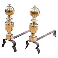 A Pair of Italian Baroque Brass and Iron Andirons