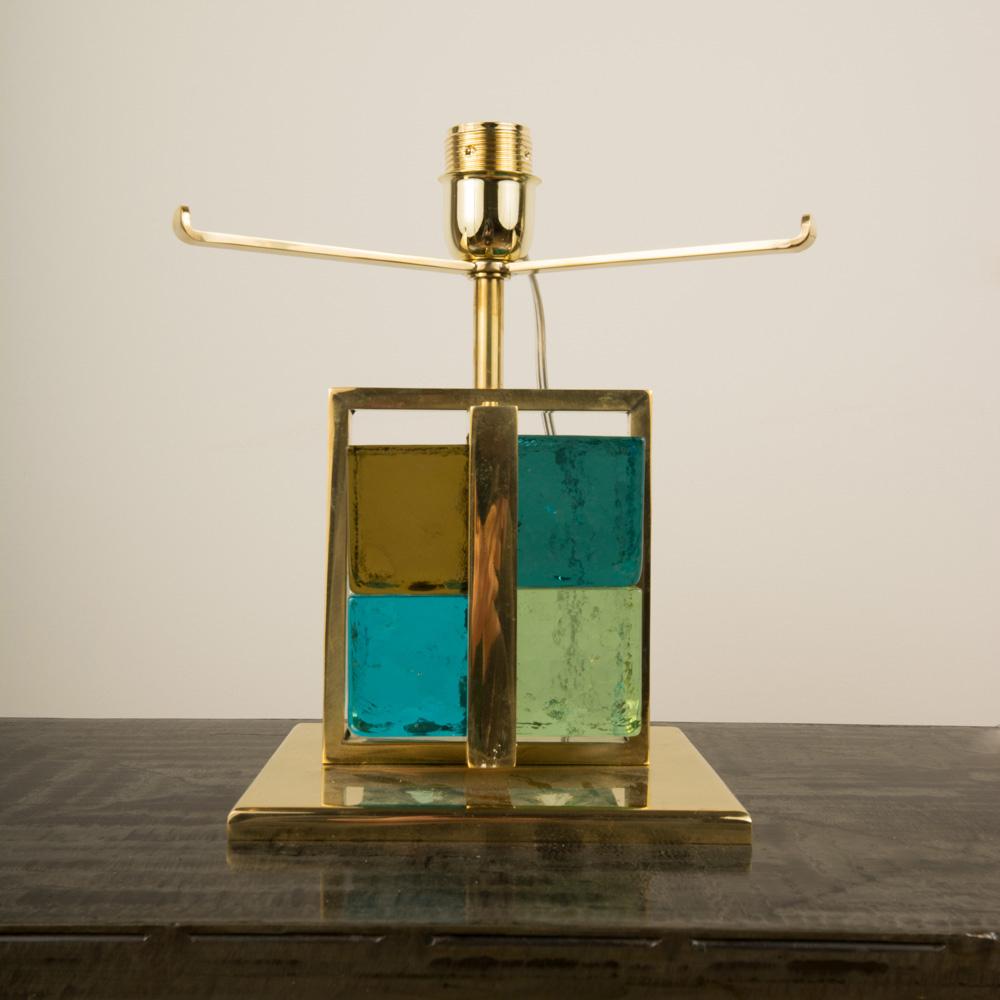 A pair of Italian brass cage form Murano glass cube lamps with multi color glass blocks. Contemporary.