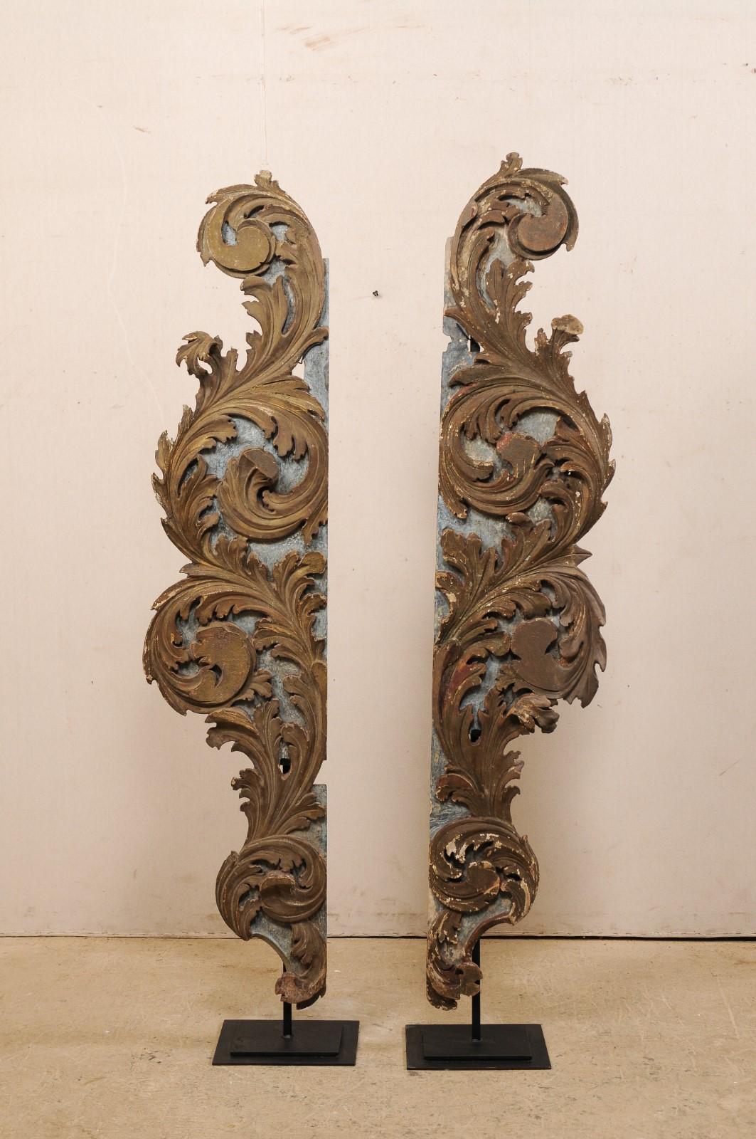 A fabulous pair of Italian carved-wood fragments from the turn of the 18th and 19th century, mounted on custom stands. These antique wooden fragments from Italy have been hand carved in a scrolling acanthus leave motif. The carvings are decorated on