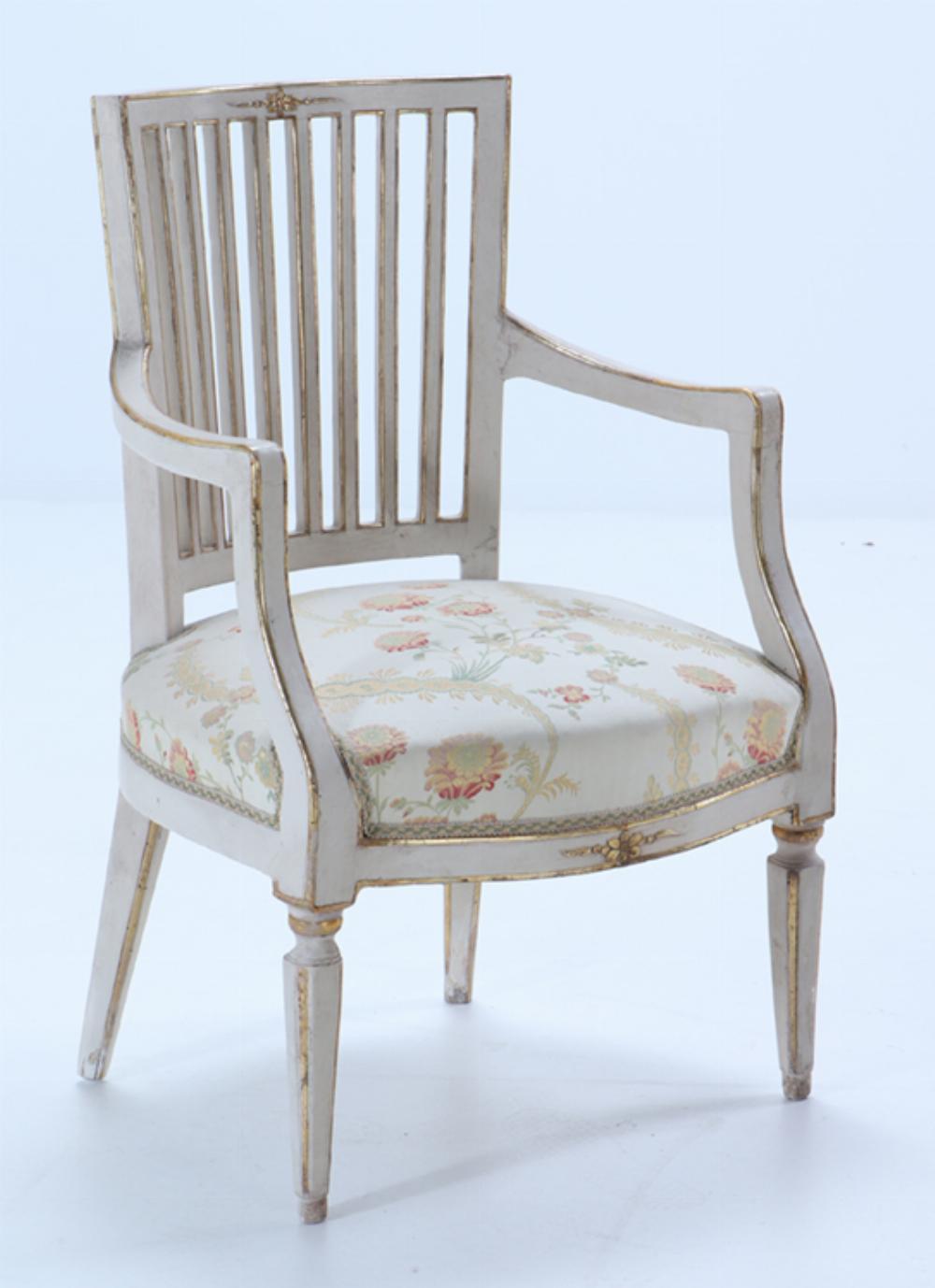 A Pair of Italian Directoire painted and gilt open arm chairs, C 1800.  This is a substantial pair of chairs and can be used every day in a sitting room, bedroom, living room!