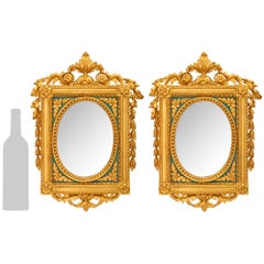 A pair of Italian early 19th century Louis XVI st. patinated and Giltwood mirror