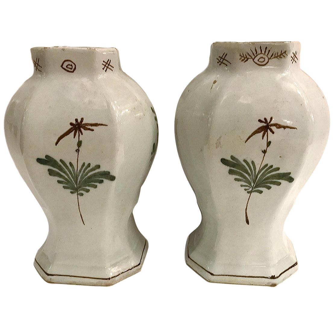 A pair of circa 1900 hand-painted Italian vases.

Measurements:
Height: 8.5
