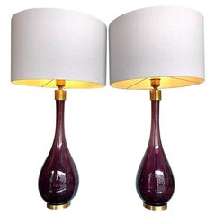 A pair of Italian large purple Murano glass and brass teardrop shaped lamps