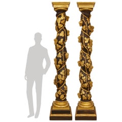 A pair of Italian late 18th century Baroque Period Polychrome and Giltwood colum