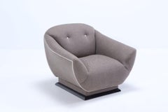 A pair of Italian loung chairs circa 1960, having new fabric