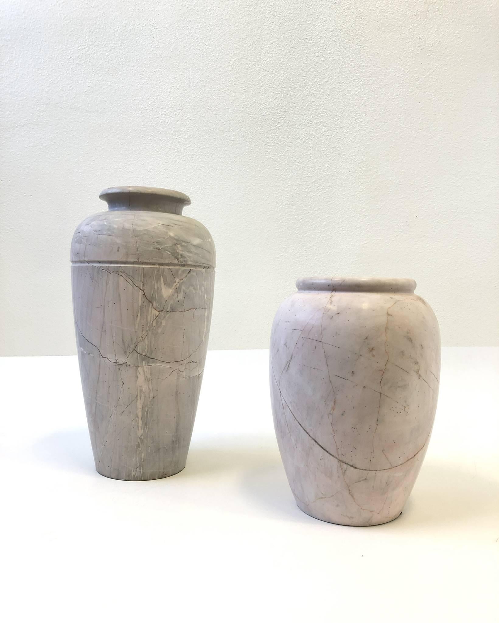 A beautiful pair of carved and polished Italian marble vases from the 1980s.
The larger one has is light gray with a little blush. The smaller one is a blush pink color.
Dimensions: Large 20” high and 10” diameter. Small 14” high and 10” diameter.