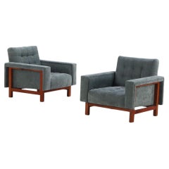 A pair of Italian Mid Century Modern walnut lounge chairs, C. 1960.