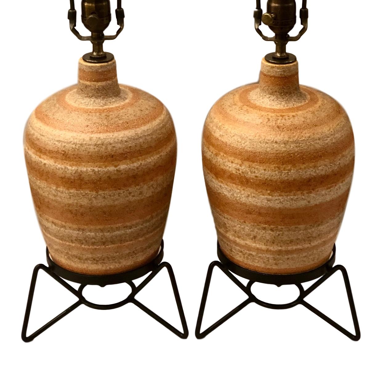 A pair of Italian circa 1950s ceramic table lamps with iron bases.

Measurements:
Height of body 15