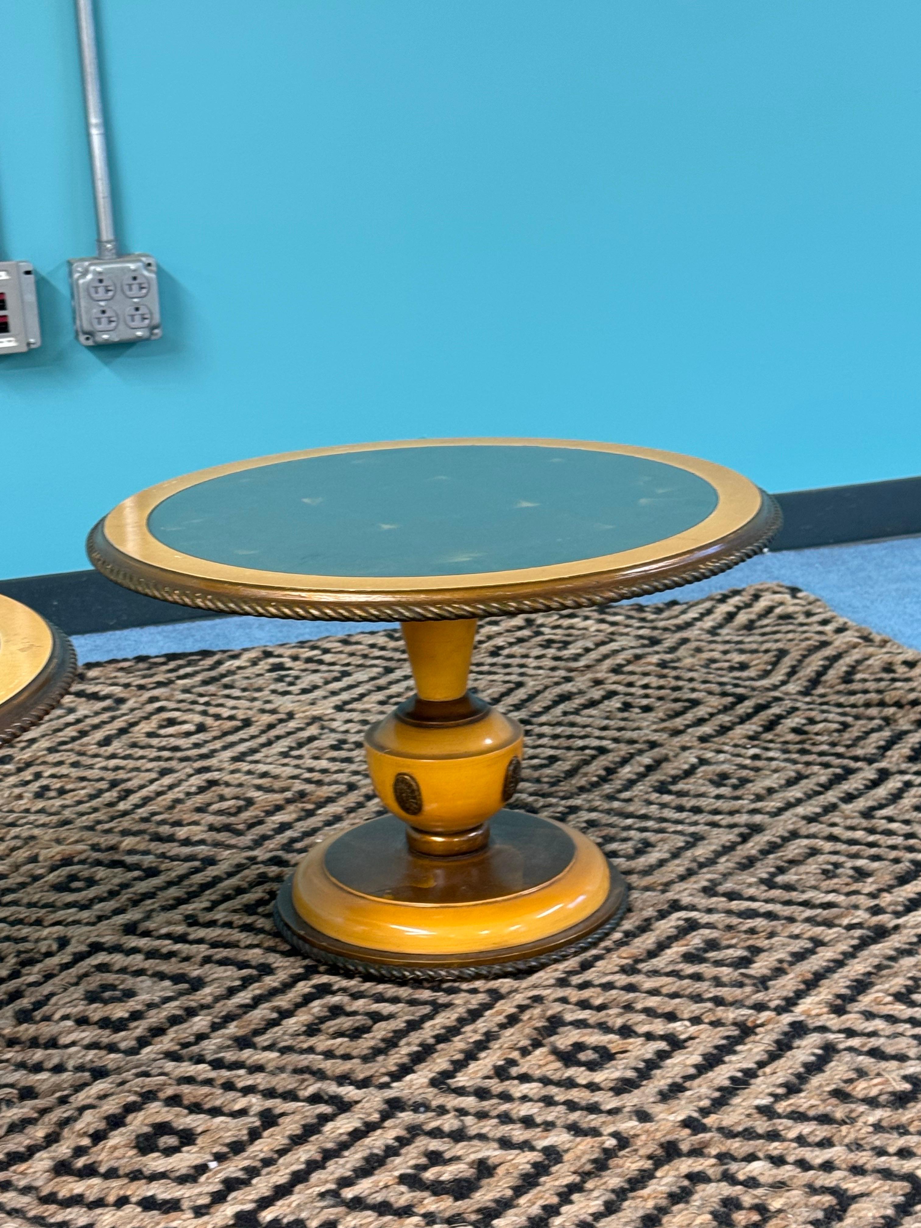 An original Condition Pair of Neoclassical Italian Paint Decorated and partial guilt low cocktail tables with Glass Tops over Guilt Gold tops and a carved and guilt pedestal bases. 