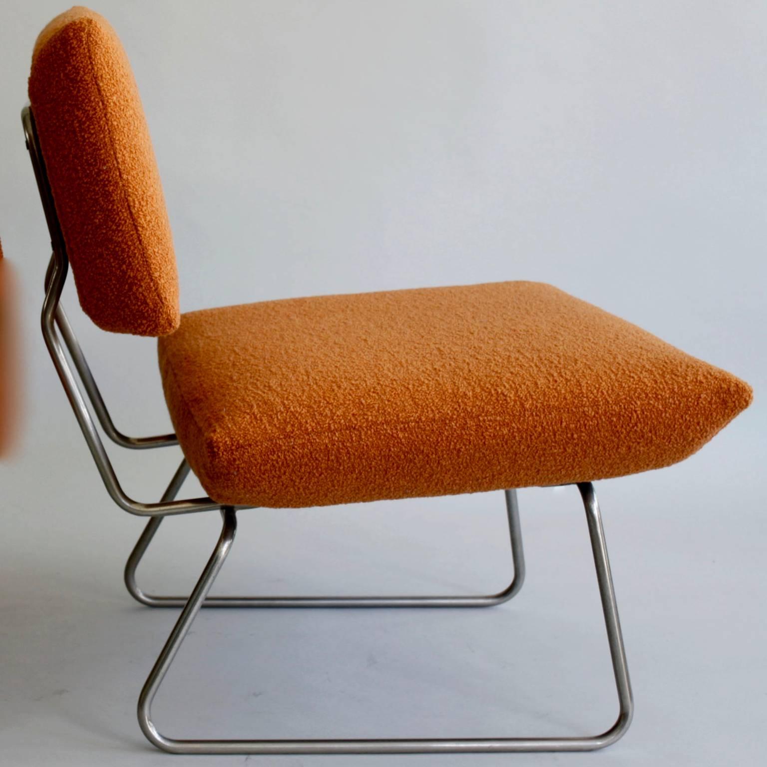 Two Arflex lounge chairs, Italian 1960s, re-upholstered in a woollen orange bouclé.