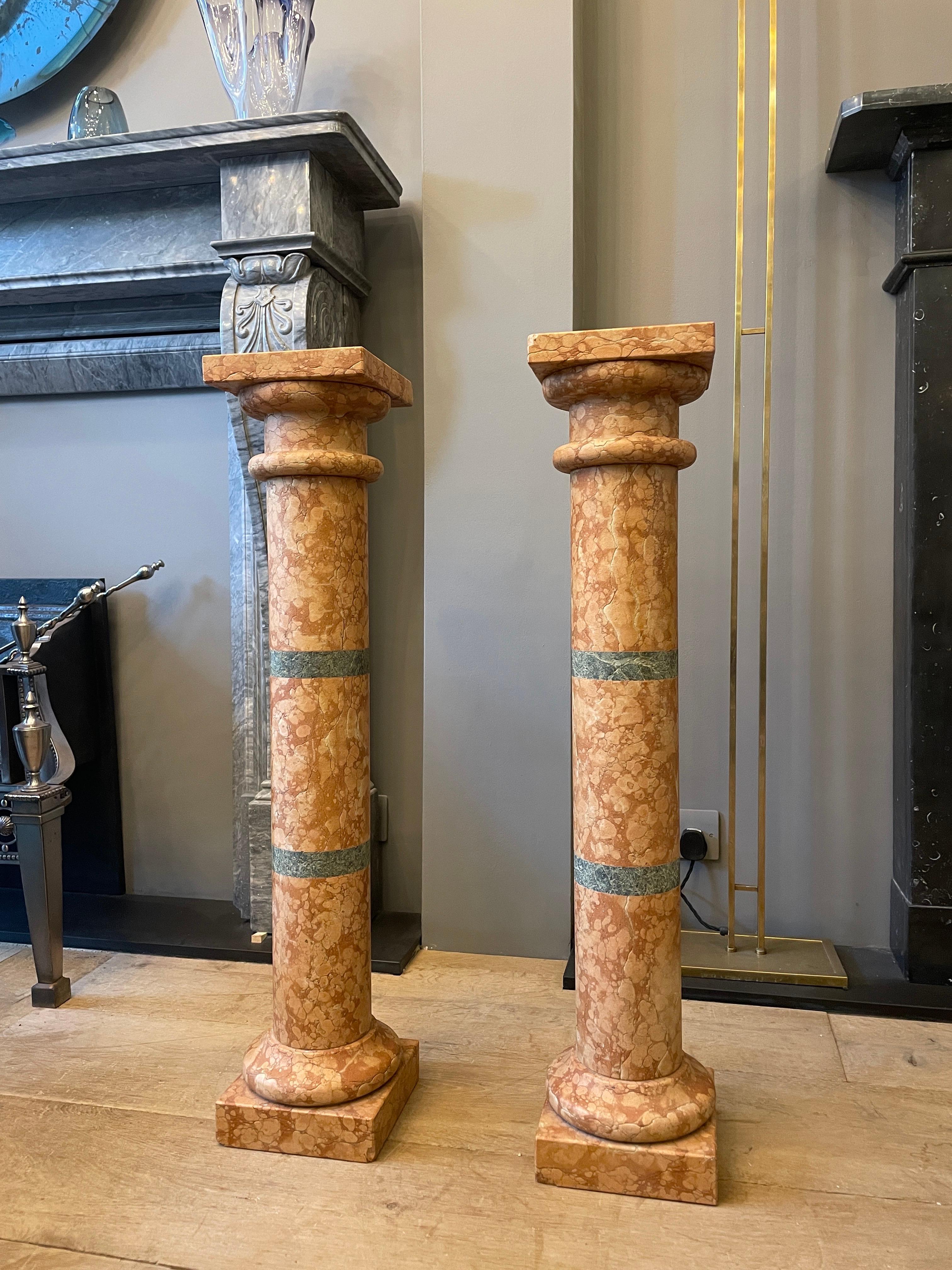 A tall and slender pair of Pedestals/columns in Pink Rossa Verona marble with Antico Verdo banded centres. With square plinth and socle terminating in a shaped capital. Images are a true reflection of condition 

Italian Early to mid 20th century.