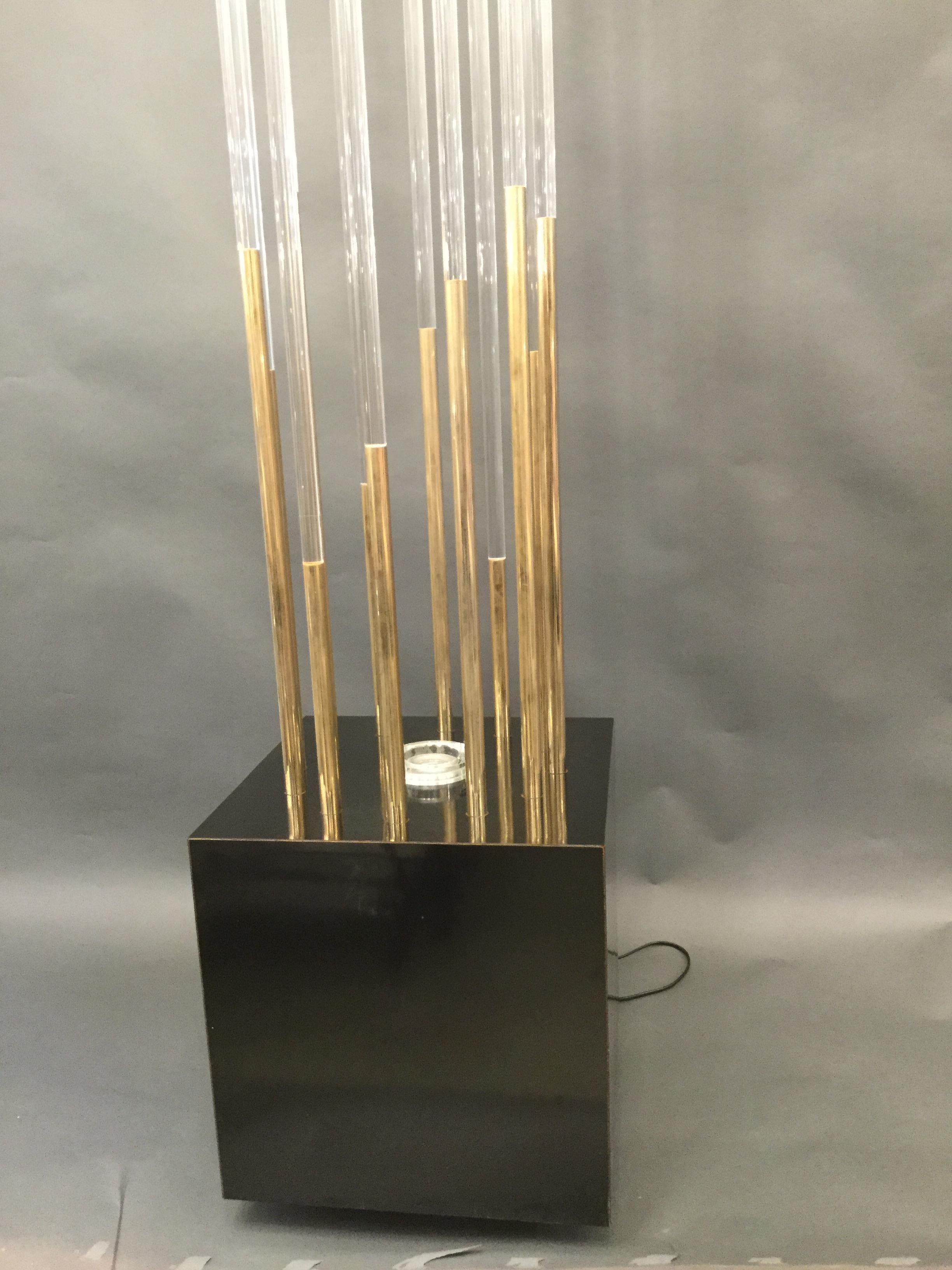 A stunning pair of Italian sculptural  floor lamps the bases are black lacquered cubes supporting 12 cylinder Lucite and chrome rods.
 Attributed to Willy Rizzo circa 1970.