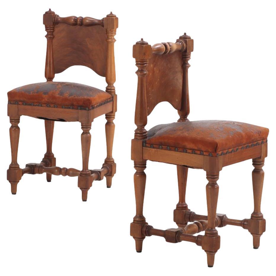 A pair of Italian Renaissance Revival mahogany "upright" side chairs, 19th C.