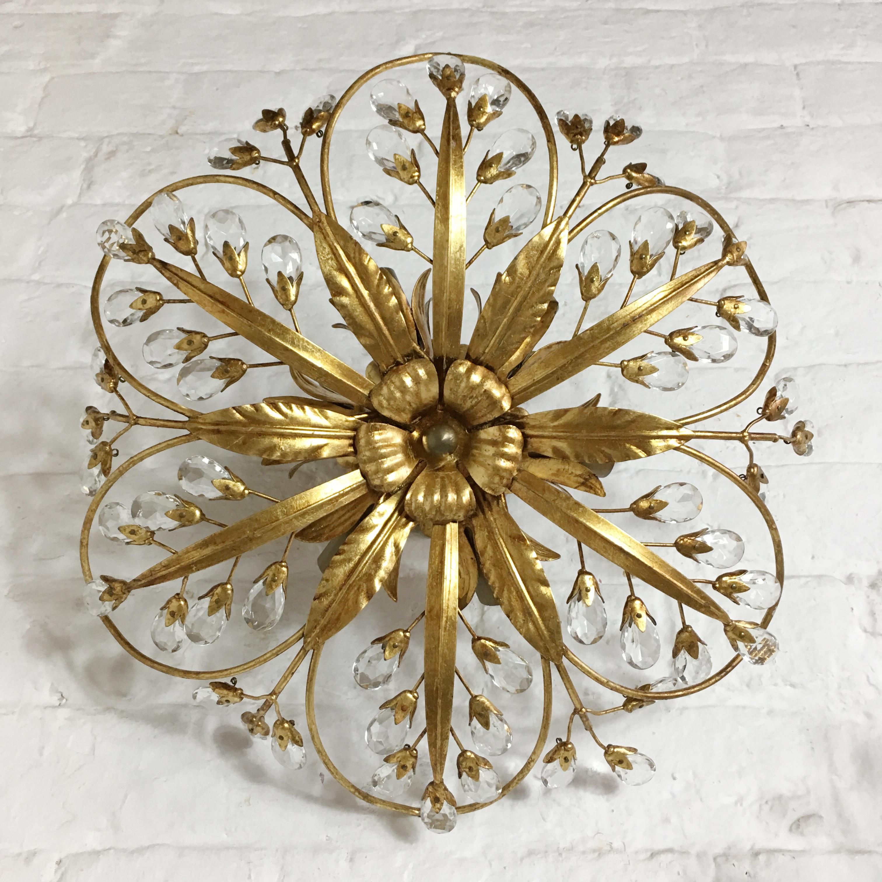 Vintage Italian Swarovski Crystal Gilt Flush Lights. Handcrafted gilt metal flower shaped flush ceiling lights. The gilt metal work is formed into flower shapes. A multitude of stems and leaves create the intricate designs. The stems are flanked by