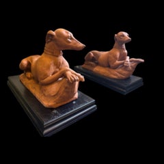 A Pair of Italian Terracotta Models of Recumbent Whippets, Late 19th century