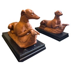 A Pair of Italian Terracotta Models of Recumbent Whippets, Late 19th century