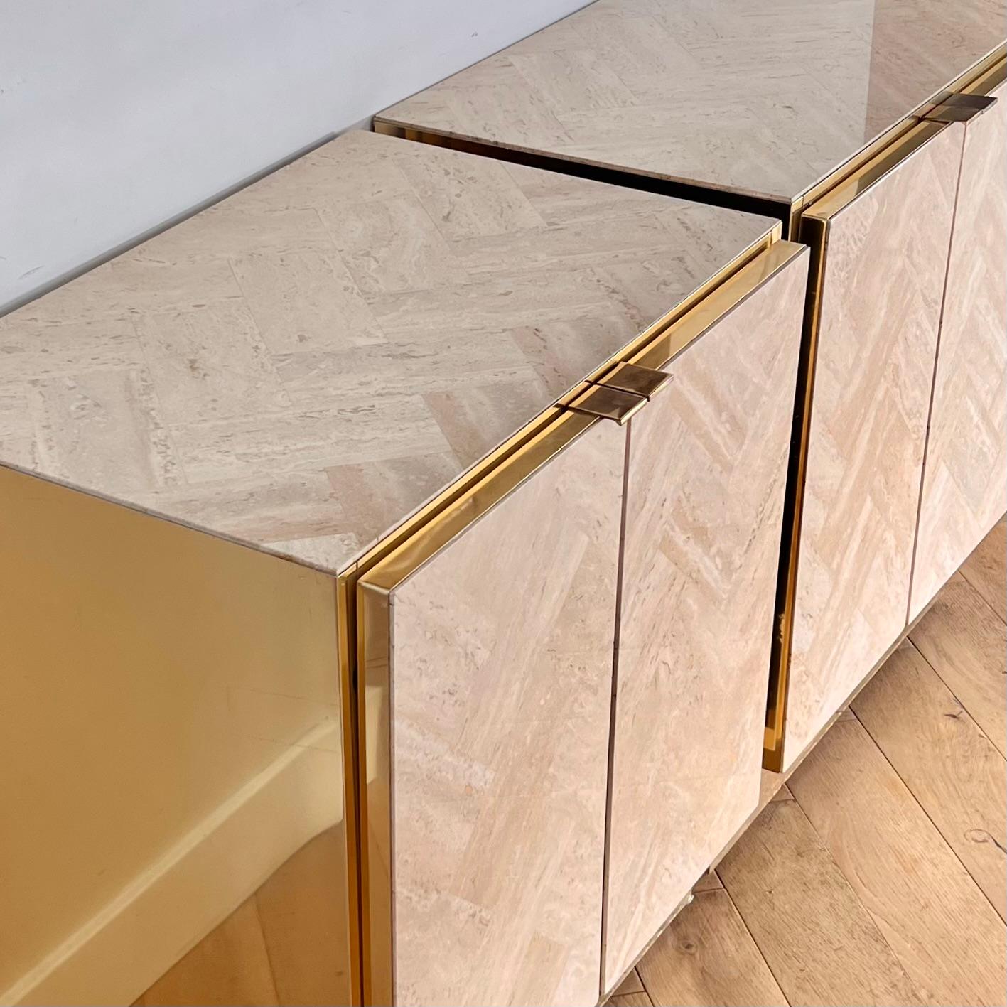 A pair of vintage Italian herringbone travertine nightstands with brass accents by Ello Furniture, circa 1970. These stunning well-made nightstands boast the marriage of stone and metal, natural materials yes - but manicured here using classic