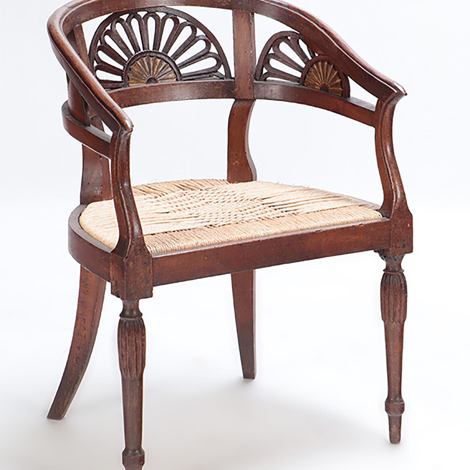 A Pair of Italian walnut open arm chairs with cord seats and cut out design, circa 1800.