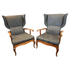 A Pair of Italian Walnut Open Arm Wing Chairs