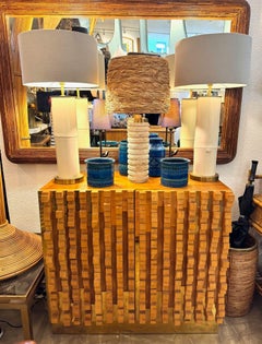 A pair of ivory lacquered real bamboo and brass lamps with bespoke linen shades