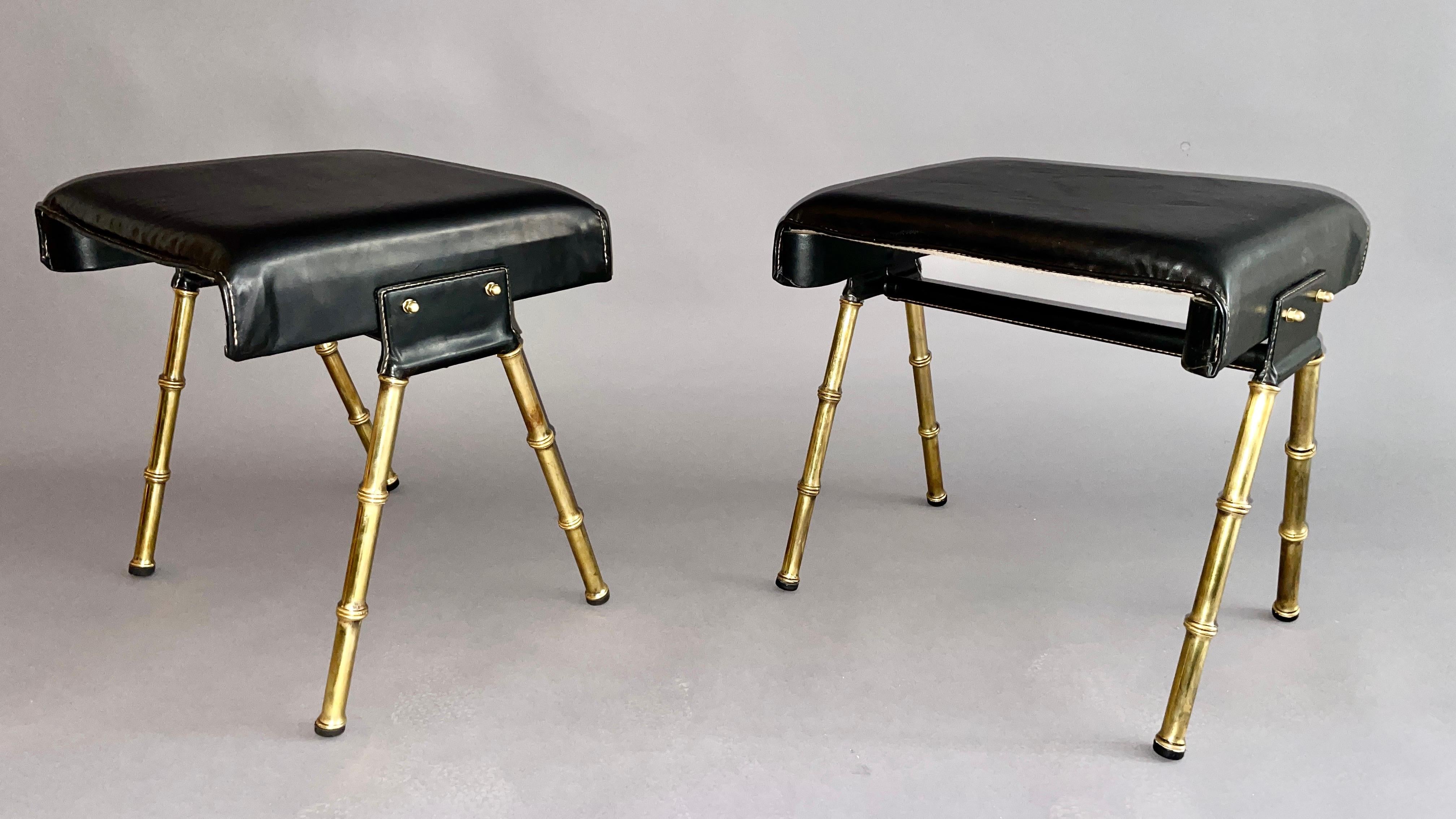 Original pair of Jacques Adnet black leather low stools 