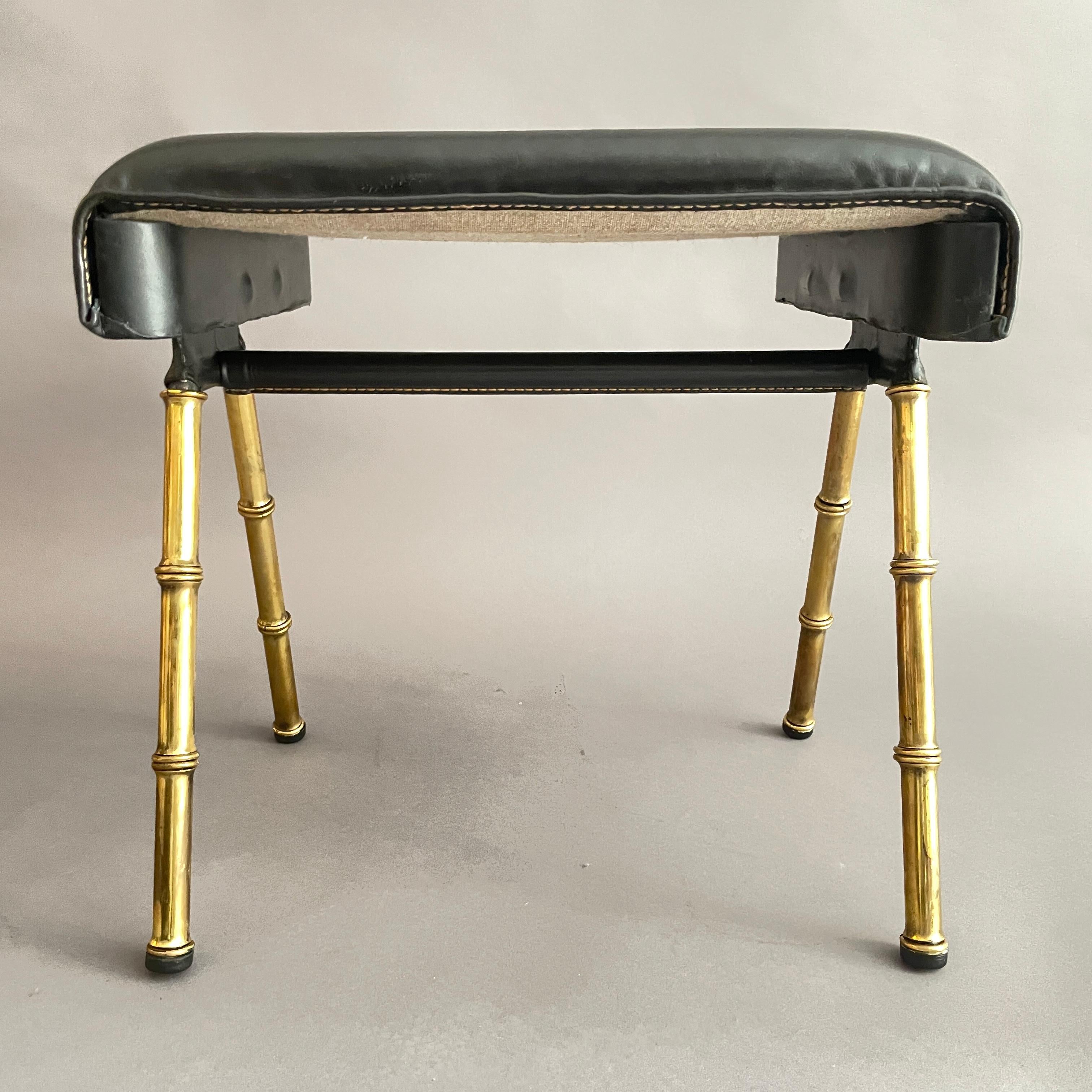 A pair of Jacques Adnet black leather and brass stools For Sale 1