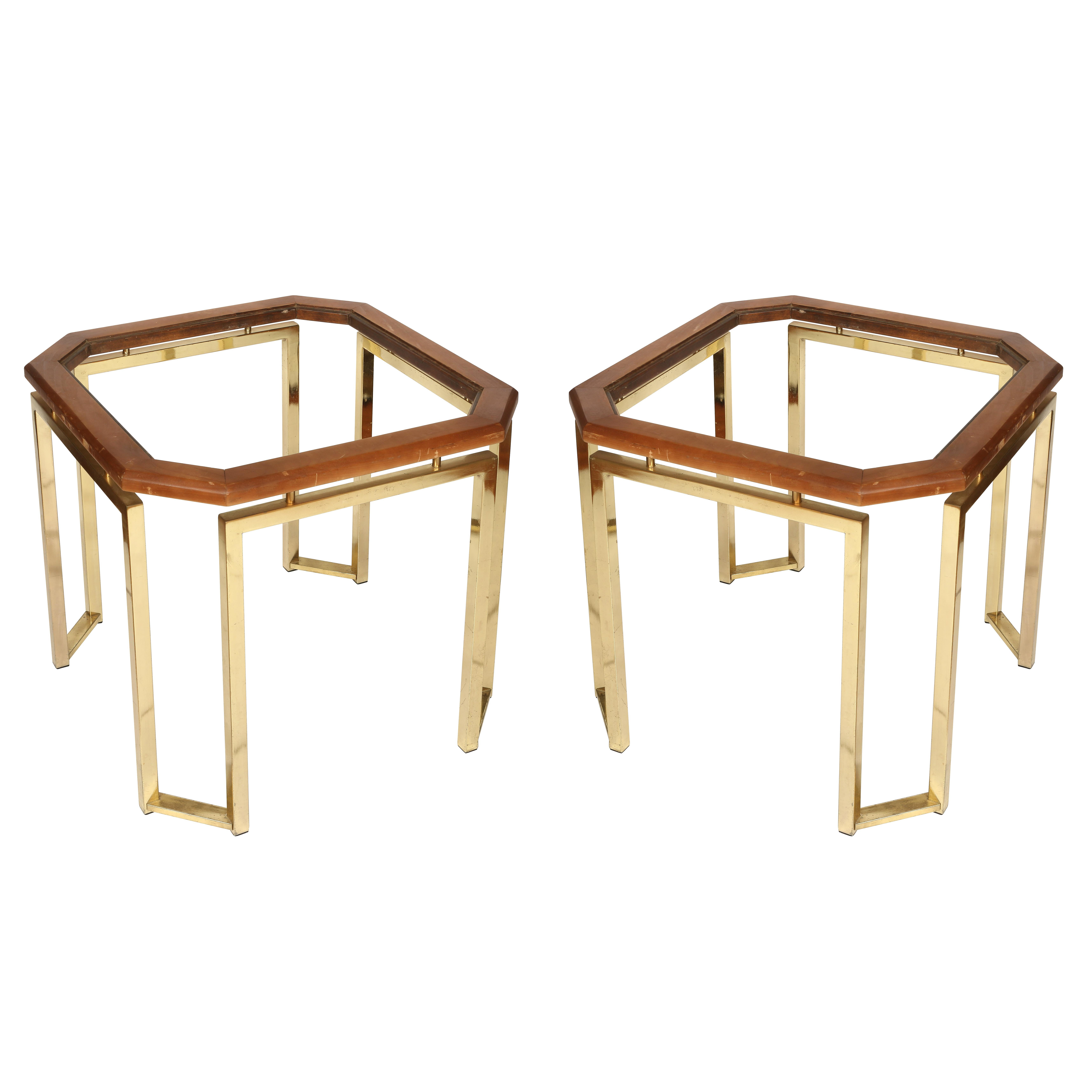 A pair of brass and wood James Mont style octagonal-shaped side tables.