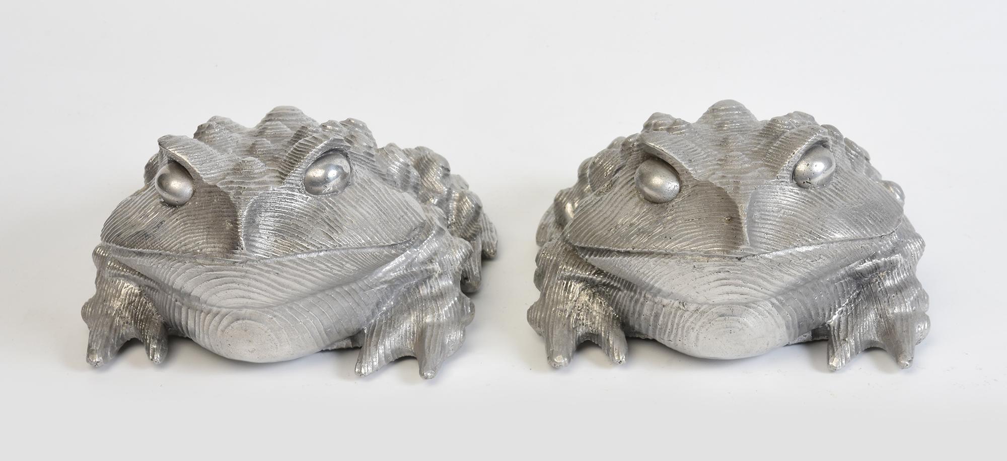 A pair of Japanese bronze toads.

Age: Japan, Contemporary
Size: Height 10.5 C.M. / Width 16.5 C.M. / Length 20.3 C.M.
Condition: Nice condition overall.