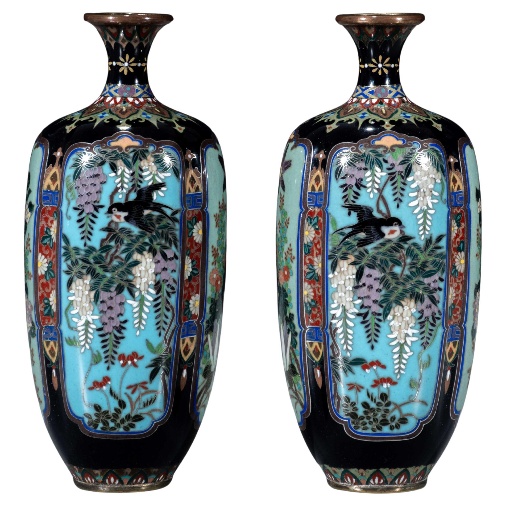 A pair of Japanese Cloisonné vases with naturalistic floral decoration