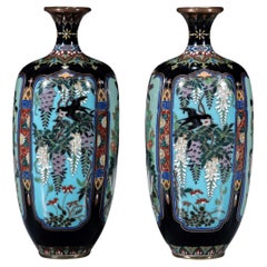 A pair of Japanese Cloisonné vases with naturalistic floral decoration