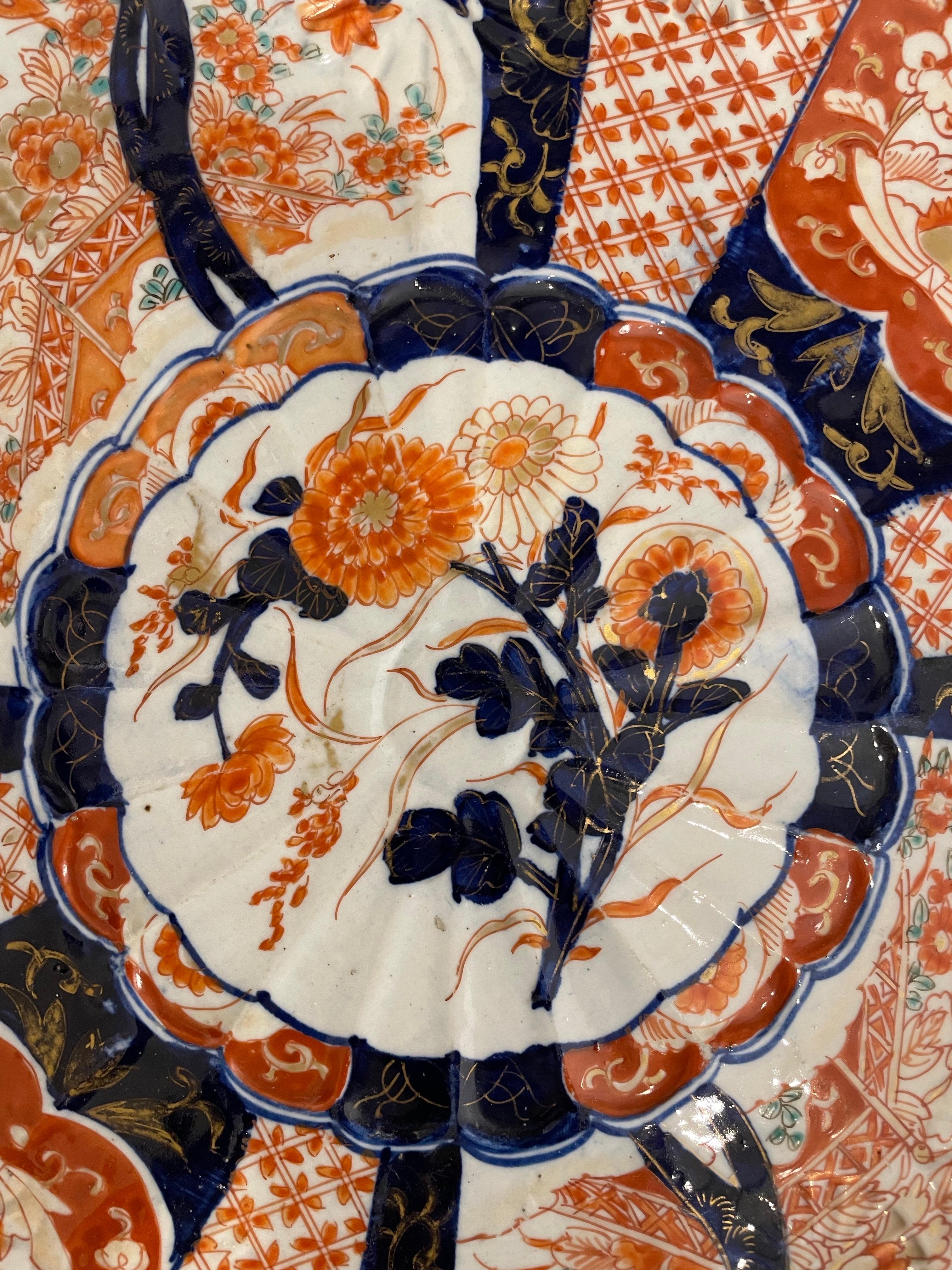 A Pair of Japanese Imari Chargers, 19th Century

Provenance: Private Australian Collection.

Description:
Each charger with a lobed border and comprising four fan-shaped panels, with two opposing panels depicting hou-ou birds in flight amongst