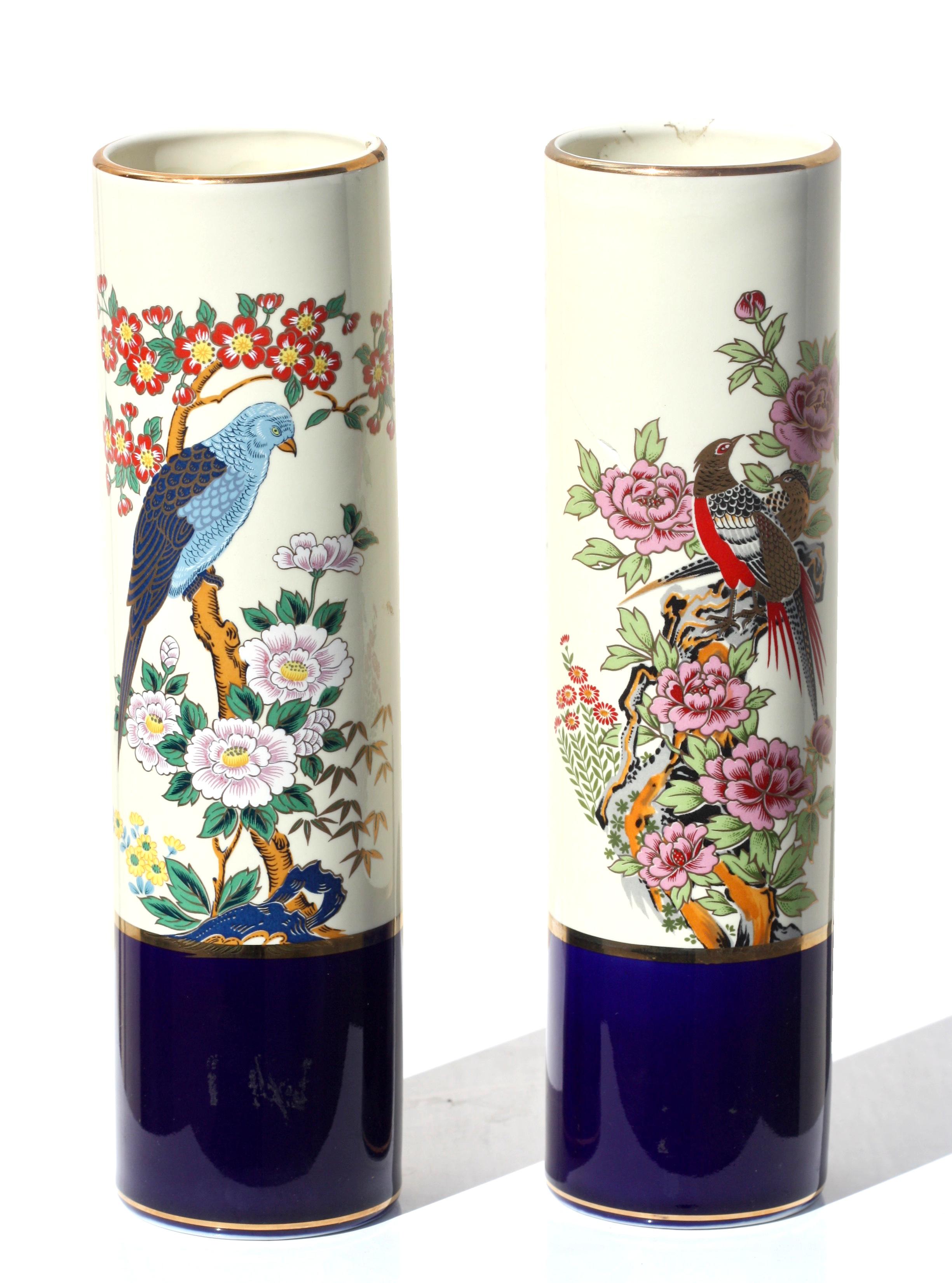 A pair of Japanese Kutani style porcelain cylindrical vases
painted with birds on flowering branches, with borders of gilt on a spotted cream ground, marked on the underside JAPAN
Height 10 1/4 in.
26 cm
Diameter 2 1/2 inches.