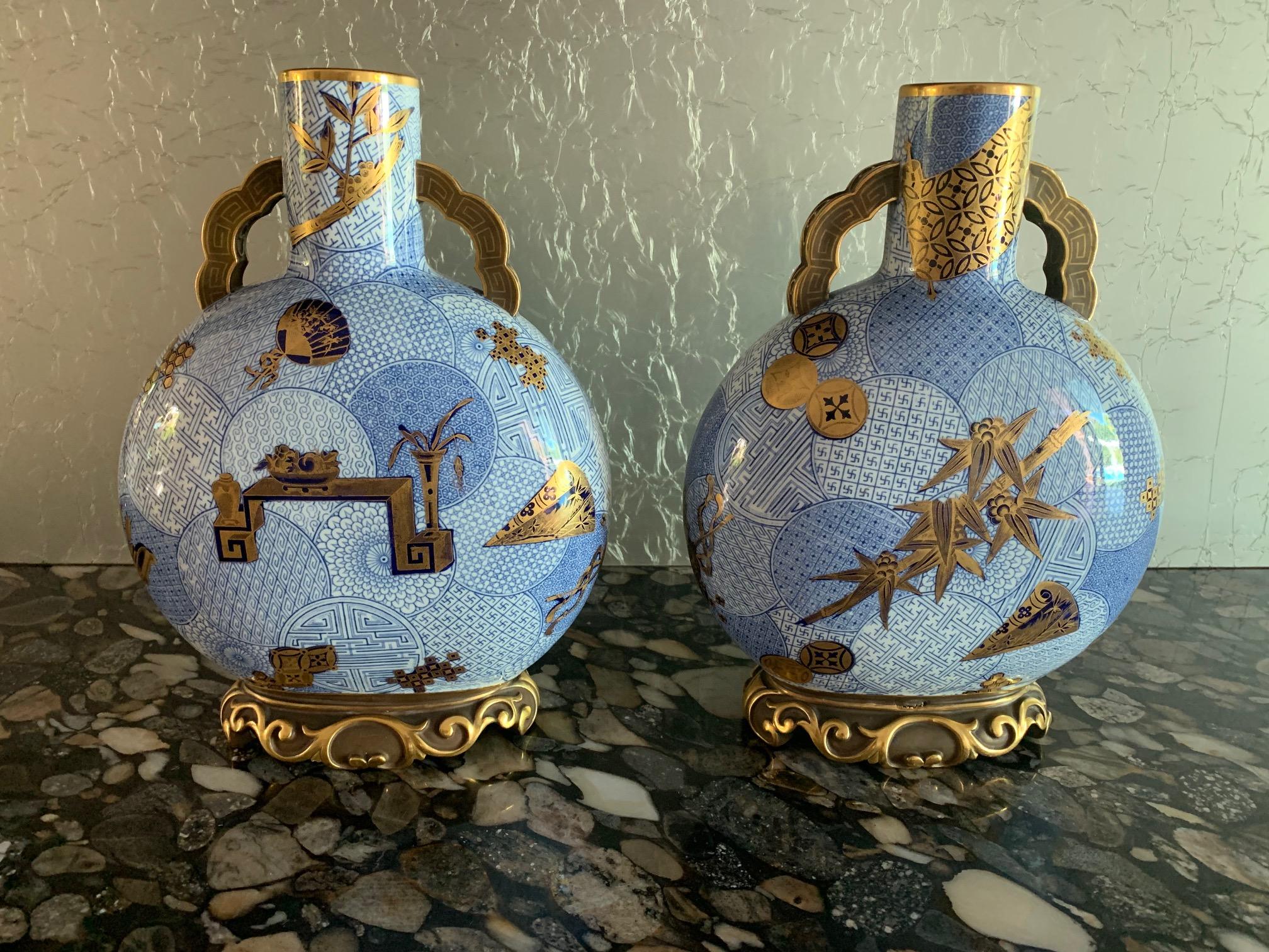 A stunning pair of glazed porcelain vases by Royal Worcester dated 1878. In the form of moon flask and with the exotic imprinted pattern of 