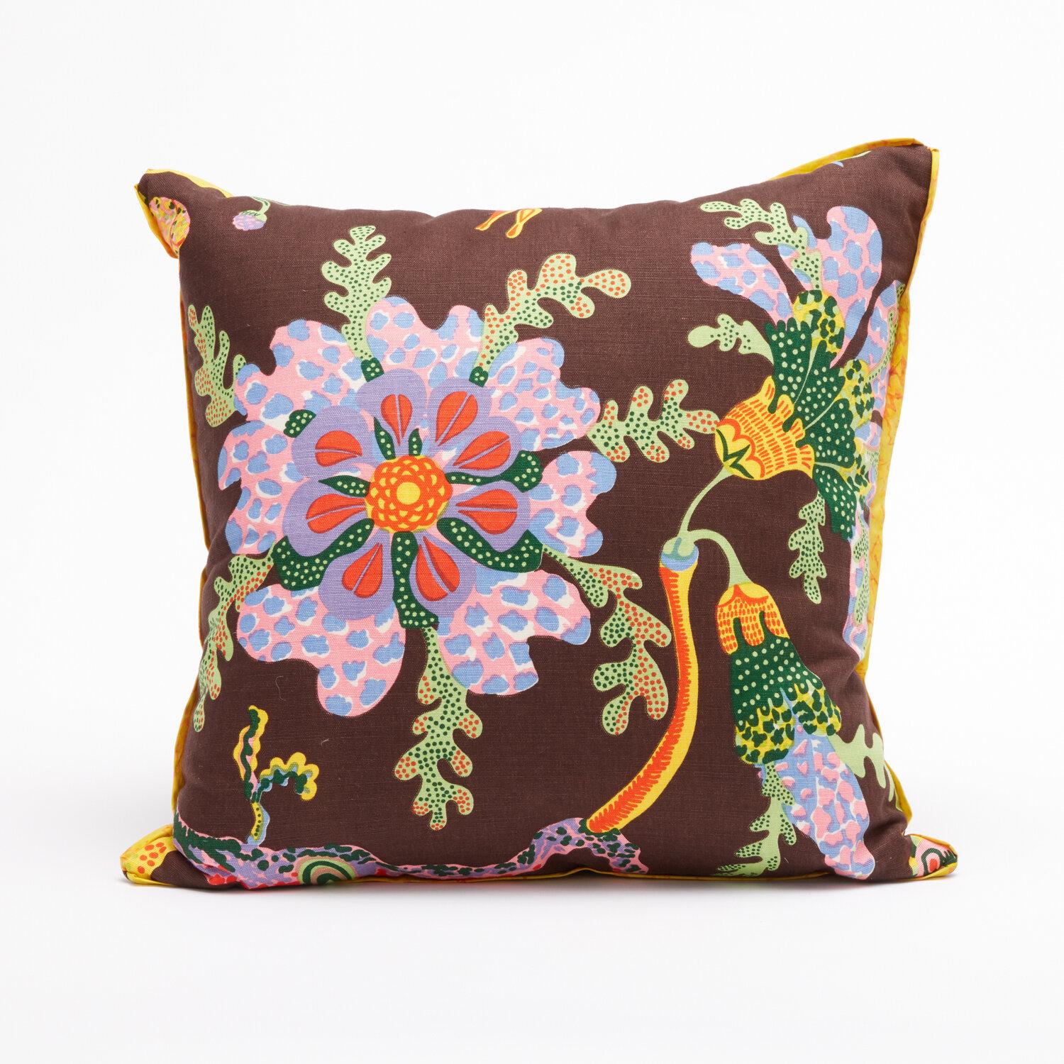 A pair of cushions featuring vintage fabric by Austrian designer Josef Frank. Each cushion displays a design motif from Josef Frank's 