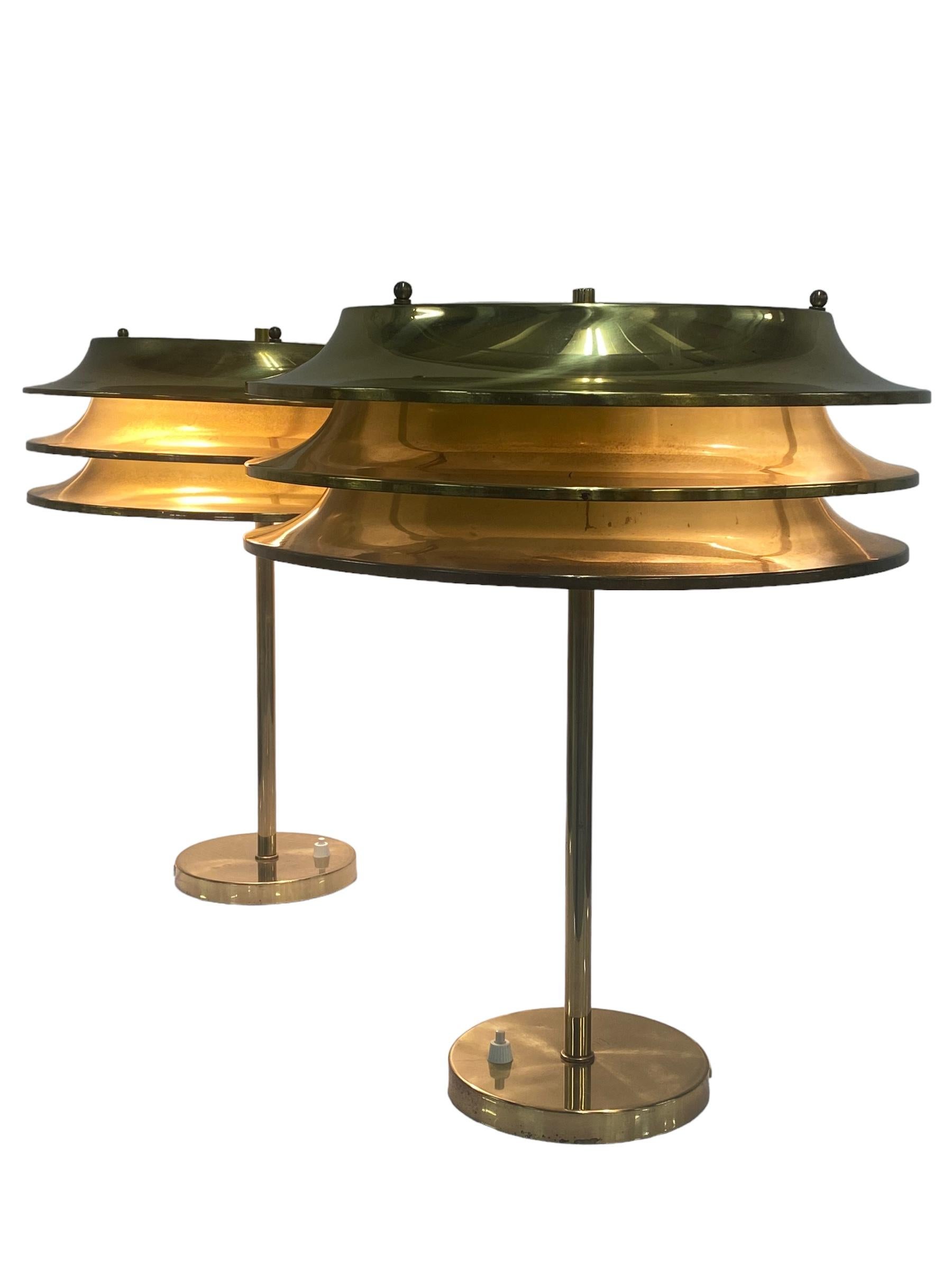 This pair of lamps was designed by Kai Ruokonen, originally for the Vaakuna Hotel in Helsinki in the 1970s. The same model was also used later in the Palace Hotel Helsinki. Very simple yet elegant heavy duty lamps in full brass with a beautiful