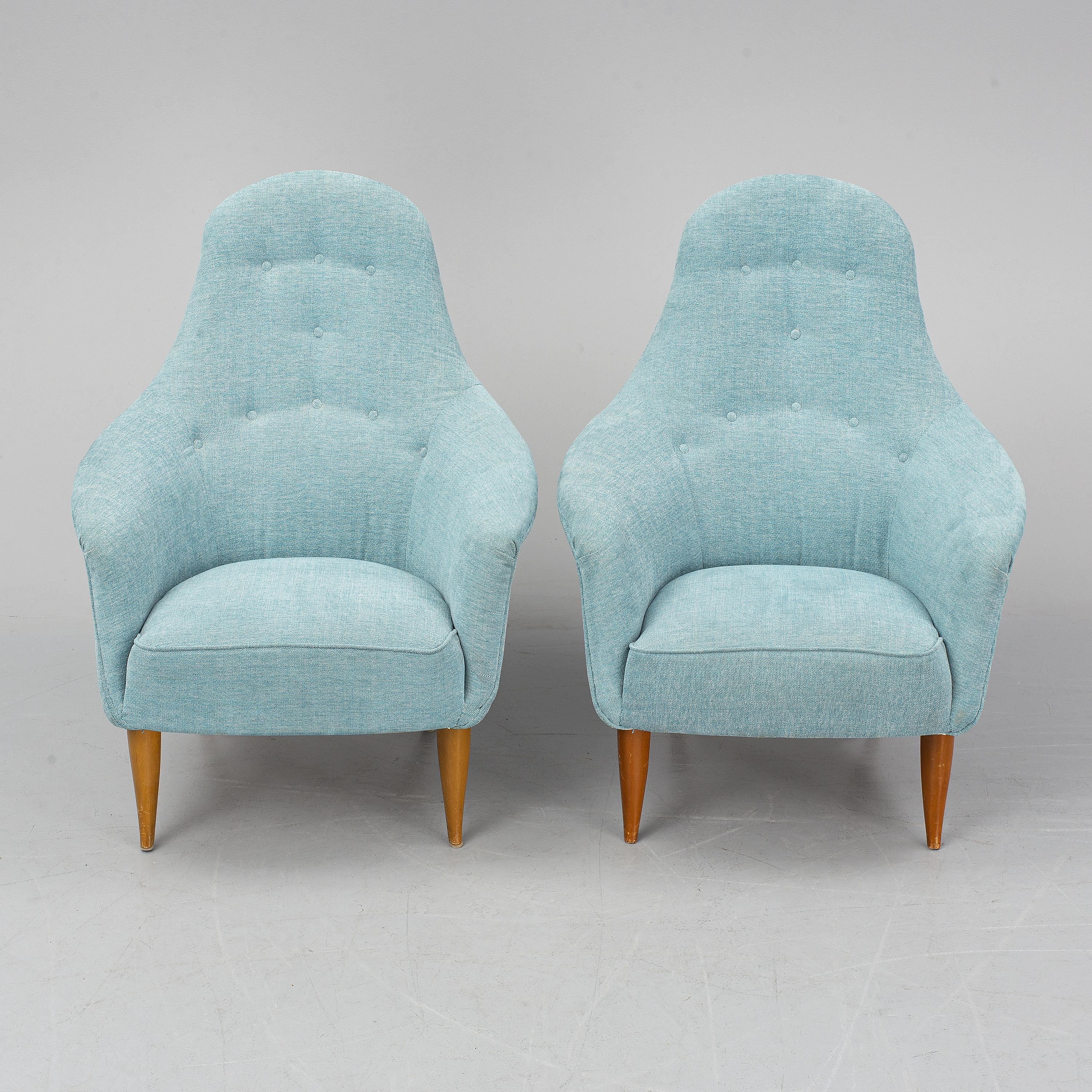 A playful pair of Birch armchairs designed by Kerstin Horlin-Holmquist and produced by Triva, Nordiska Kompaniet in Sweden, circa 1950s.