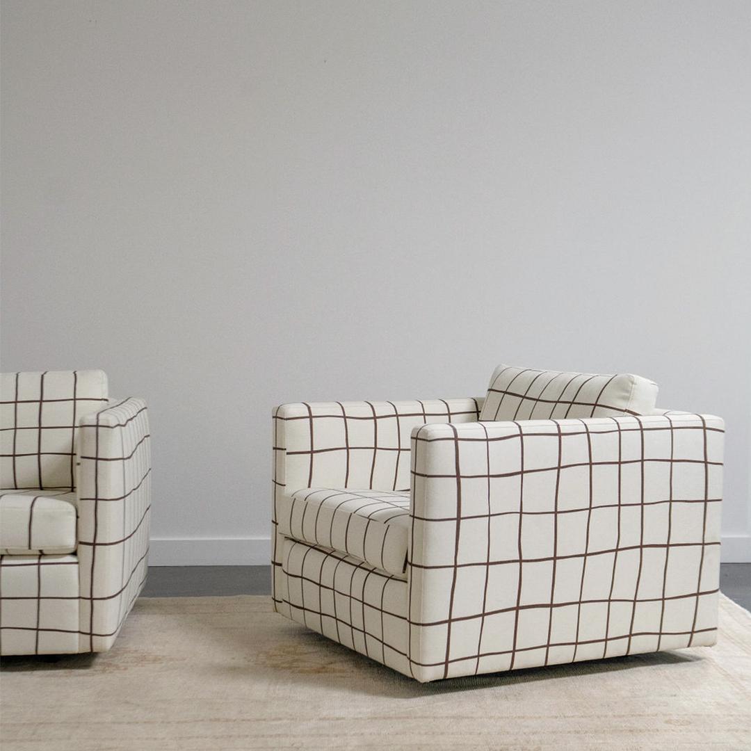 This pair of Knoll Pfister club chairs are cubist in form set atop a seemingly floating base. Taking inspiration from chairs geometric shape, the cushions have been replaced and reupholstered in a Schumacher Painterly Windowpane linen. 

Charles