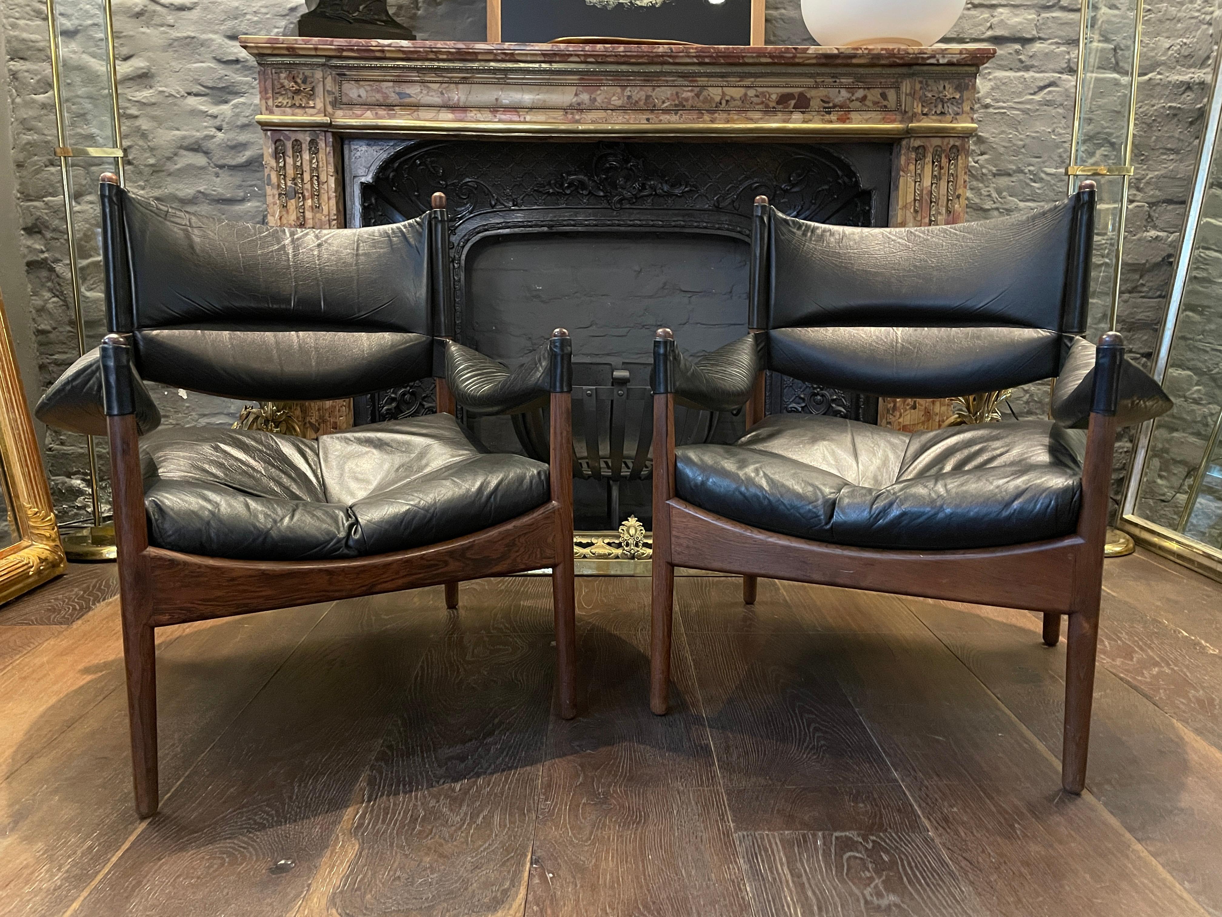 A pair of Modus lounge chairs by Kristian Vedel an award winning designer at the Milan Triennial. 
Having their original full grain leather upholstery and Brazilian wood frames, the pair are in very good order. Produced by Soren Mobelfabrik in