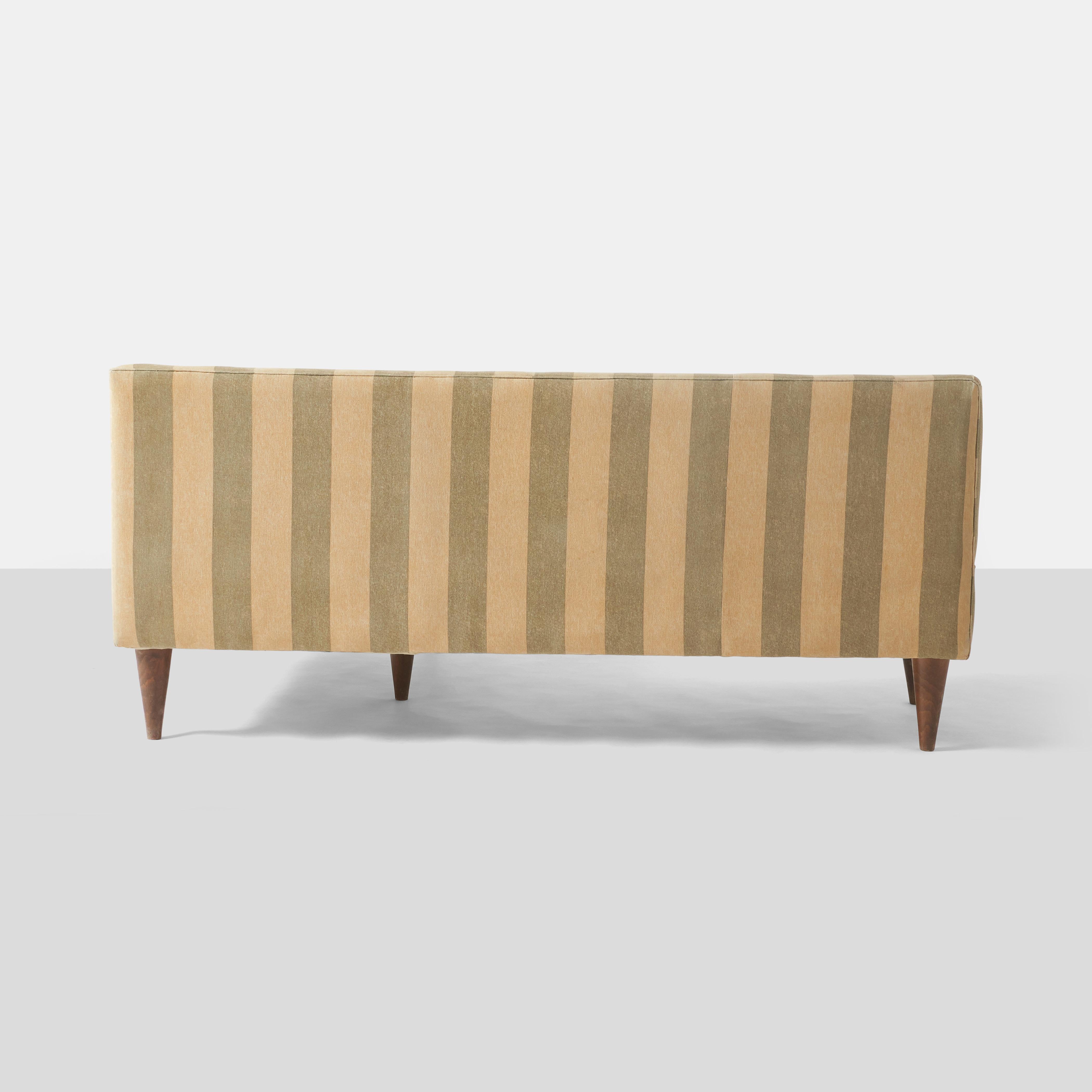 Italian A pair of L shaped sofas by Giulio Minoletti For Sale