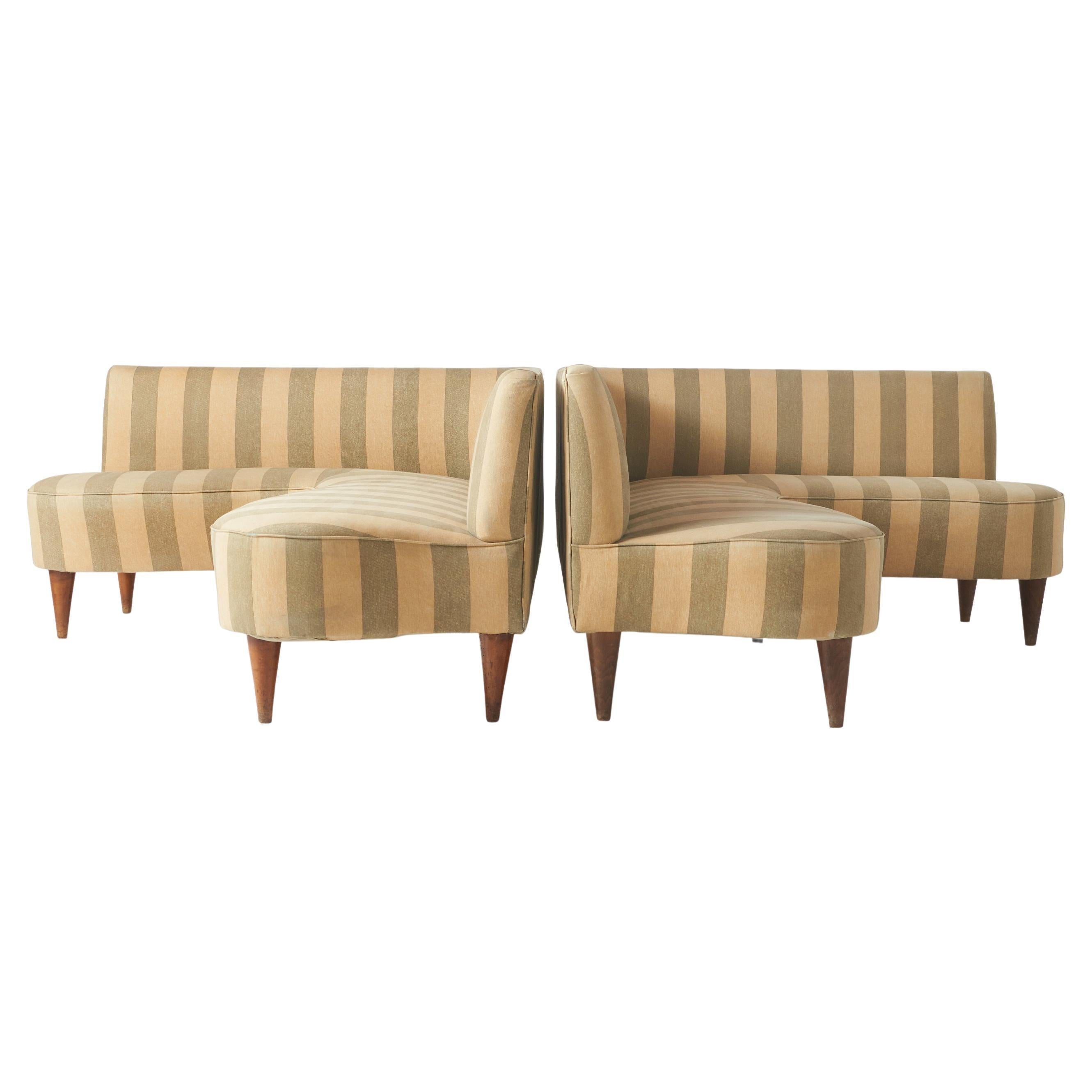 A pair of L shaped sofas by Giulio Minoletti For Sale