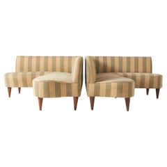 A pair of L shaped sofas by Giulio Minoletti