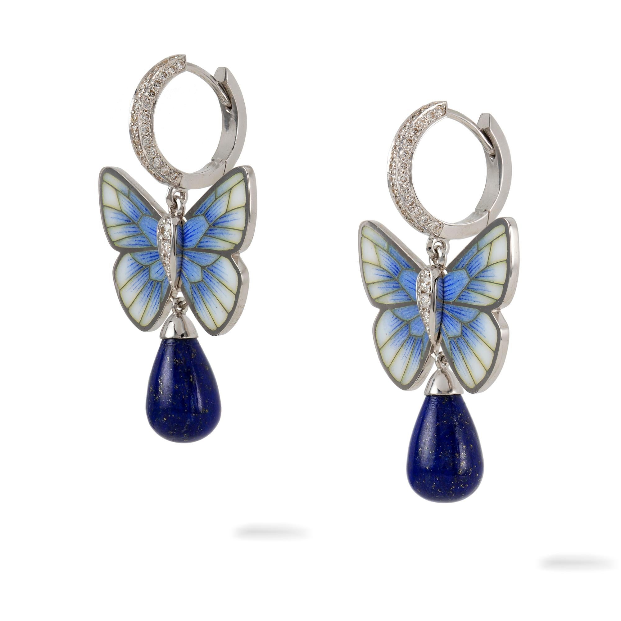 A pair of lapis butterfly earrings by Ilgiz F, each earring with a champlevé enamelled butterfly, termination to a lapis drop, suspended by a diamond-set loop, the diamonds weighing 0.63 carats in total, all mounted in white gold made by Ilgiz