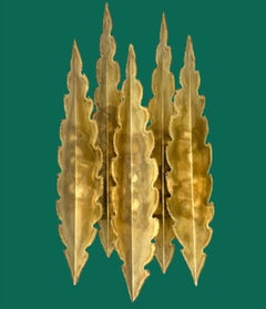 A pair of large 5 frond 1960s torch cut brass wall scocnes by Holm Sorensen