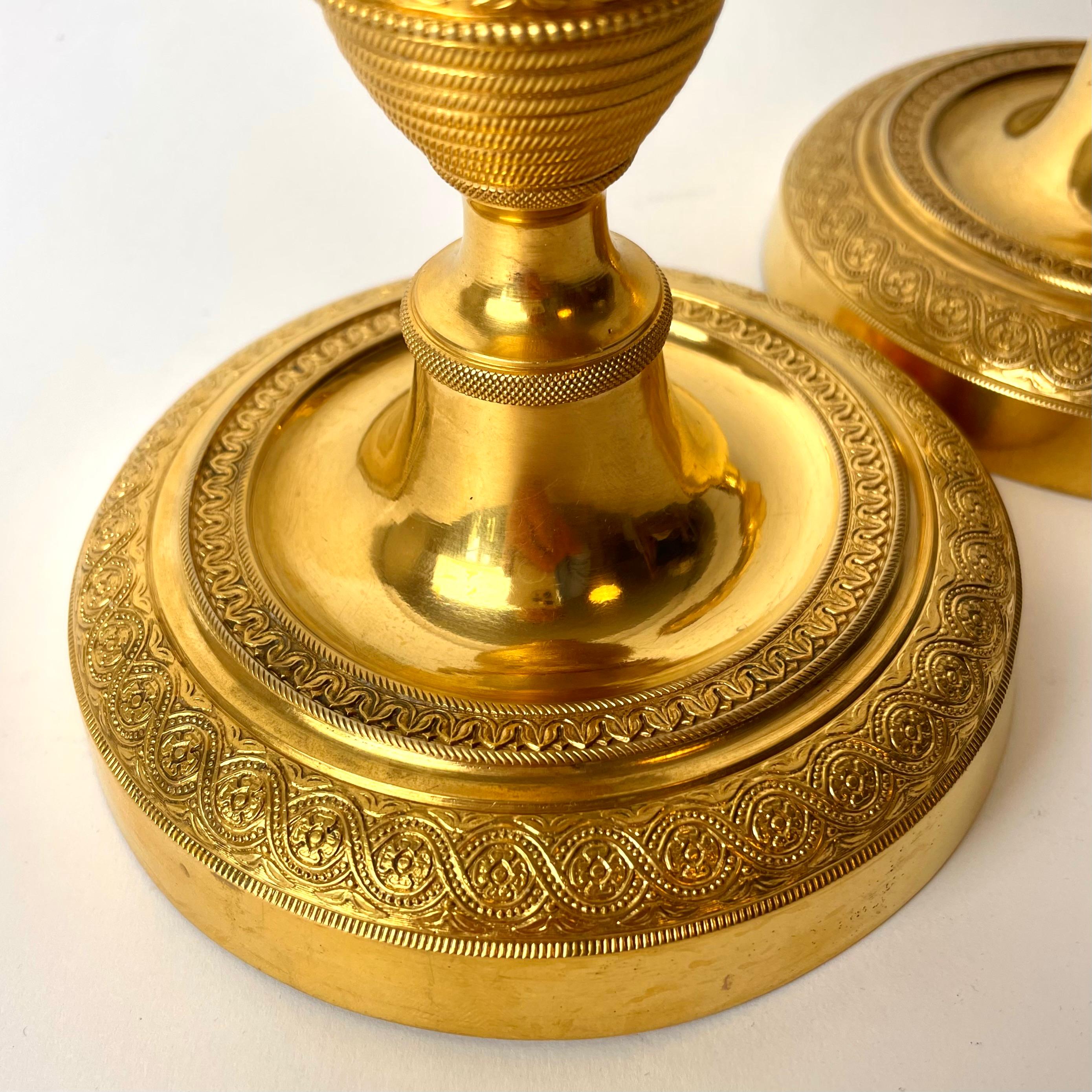 Early 19th Century Pair of Large and Sophisticated Empire Candlesticks in Gilded Bronze