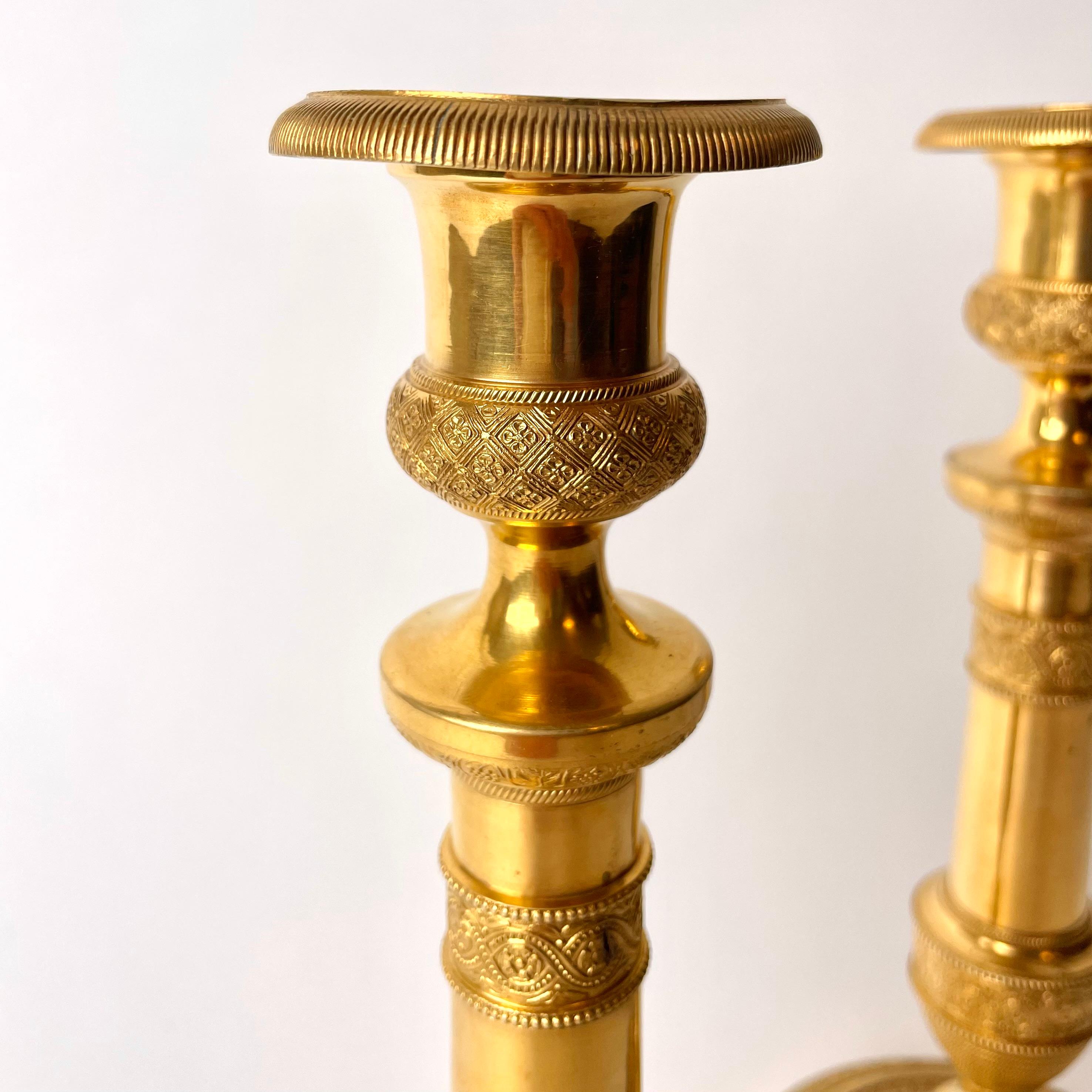 Pair of Large and Sophisticated Empire Candlesticks in Gilded Bronze 1