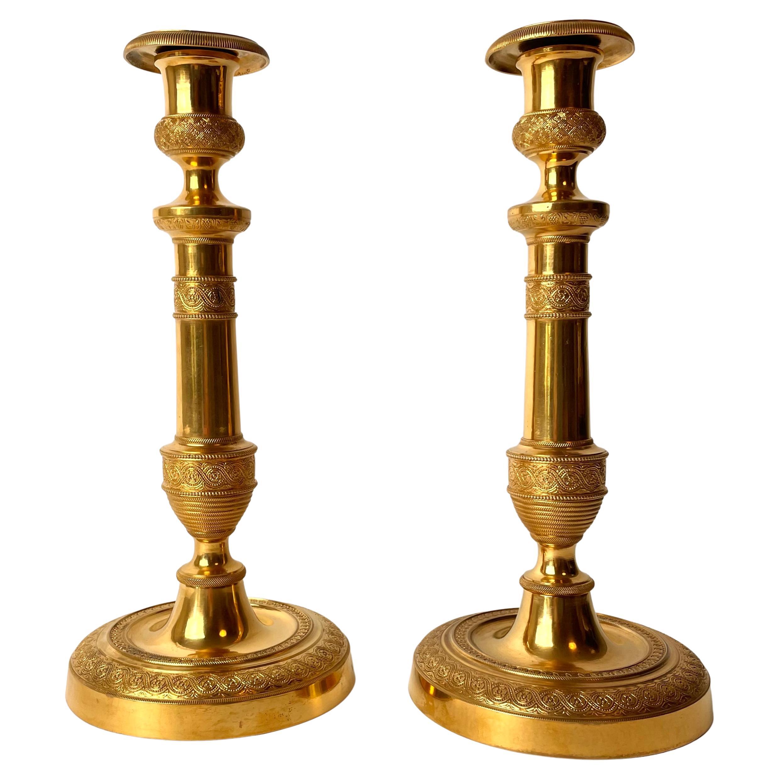 Pair of Large and Sophisticated Empire Candlesticks in Gilded Bronze